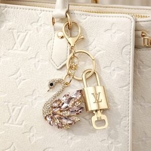 Authentic Louis Vuitton Lock & Key with unbranded Swan Bagcharm, Keycharm 030426